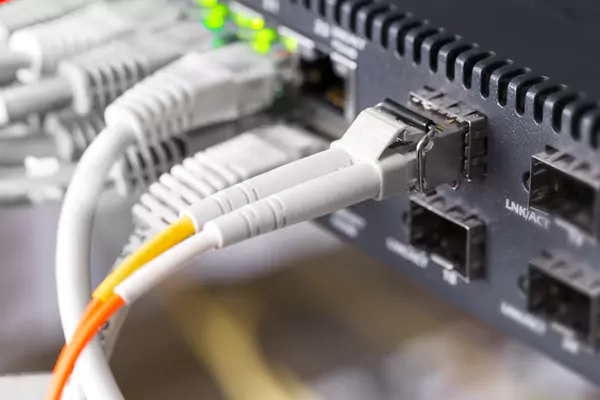 Close up of high speed fiber network switch and ca 2025 03 10 18 13 12 utc 6807ac1607c8d
